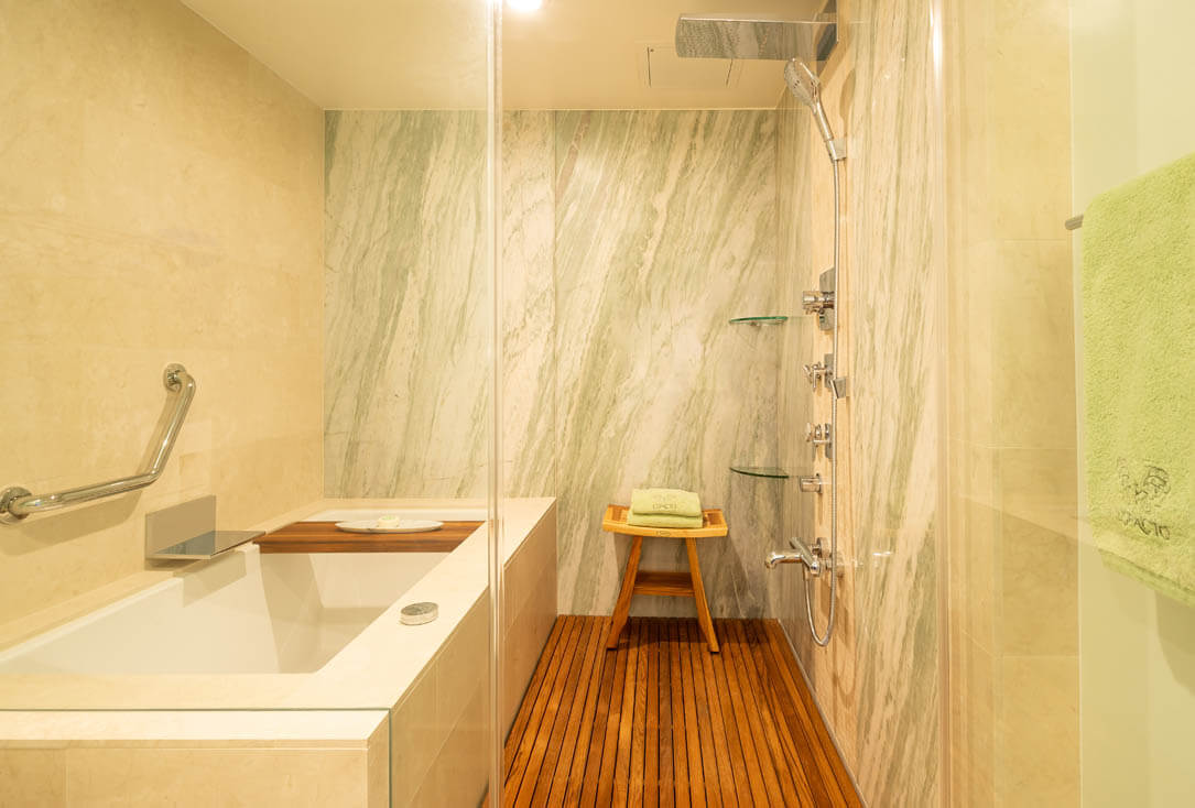 Marble bathroom and tub with separate shower.