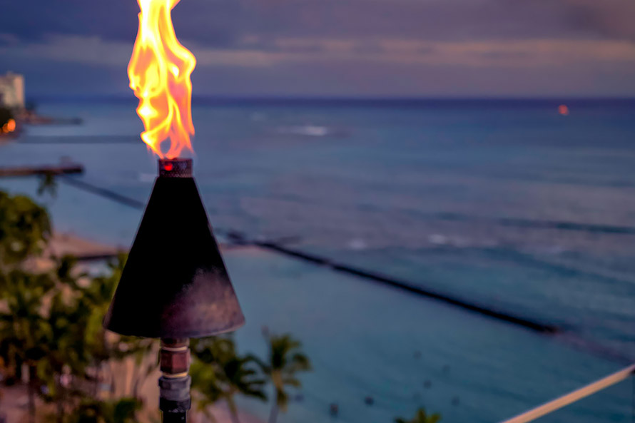 Torch with ocean view in background.