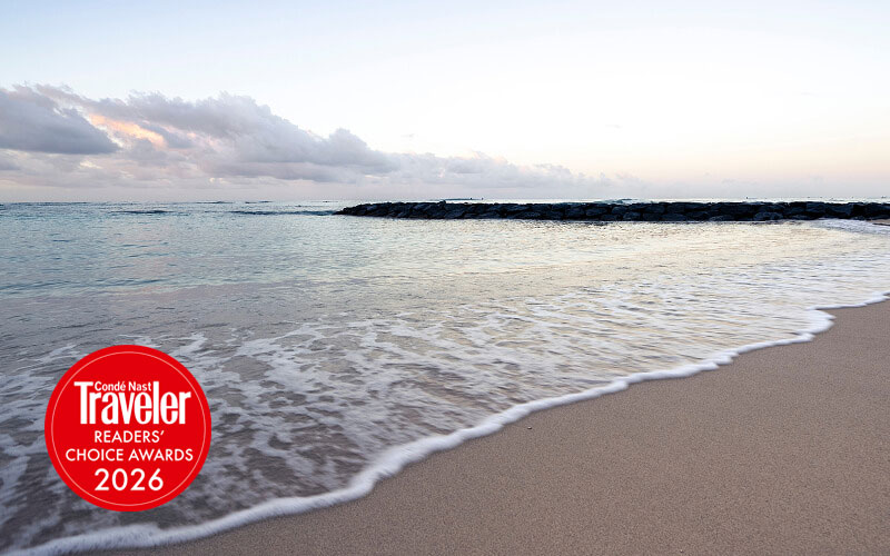 Beach shoreline with Conde Nast Traveler badge